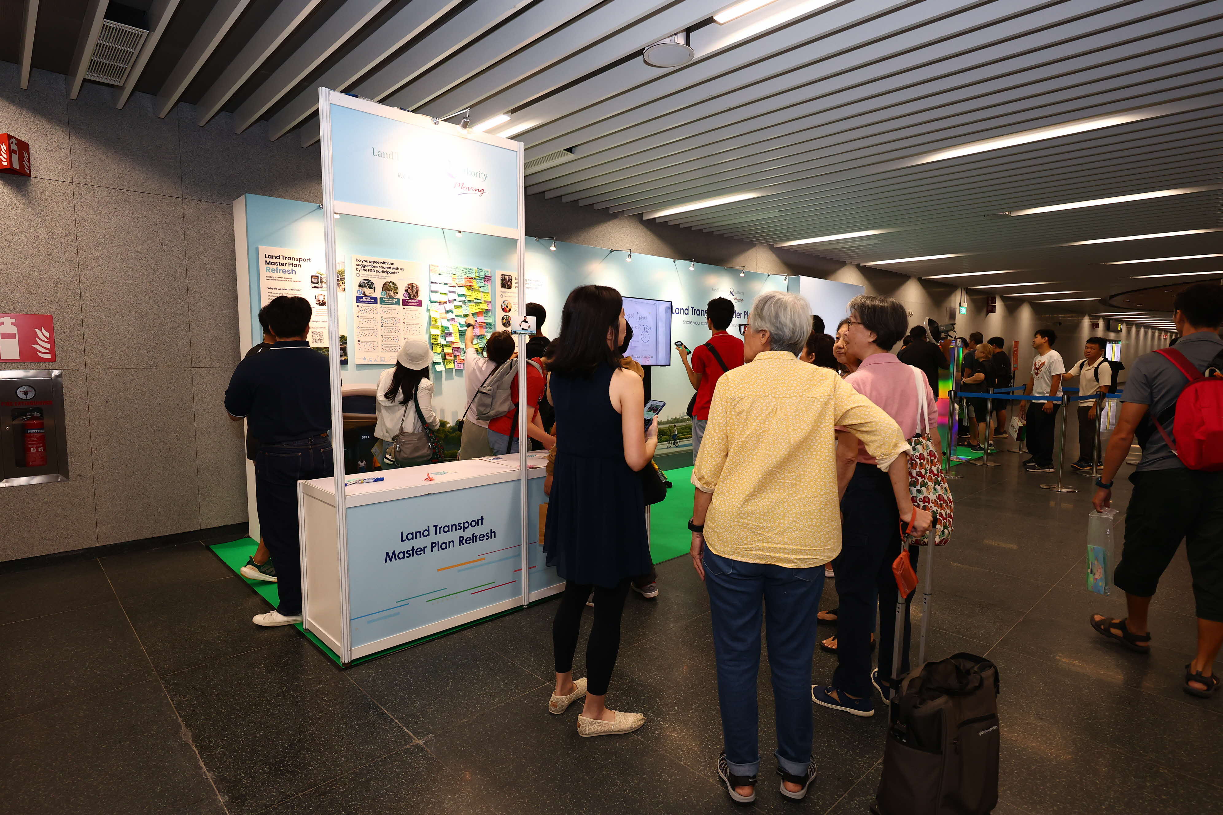 Image of a crowd gathering at a booth